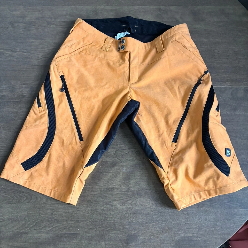 Pantalones cortos de ciclismo Race Face Ambush naranja talla grande para hombre Foto 1 de 4