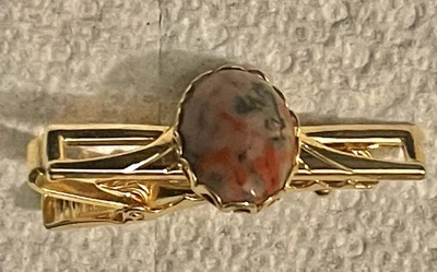 Gold Tone Tie Clip With In Oval Variegated Red And Grey Inlay Collectible - Image 1 of 4