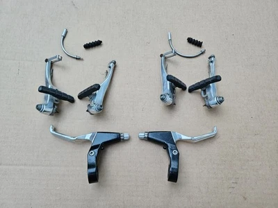 Bicicleta híbrida de montaña ProMax TX22 frenos en V + juego de palancas delanteras traseras plateadas Foto 1 de 4