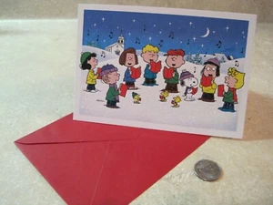 1 HALLMARK PEANUTS SNOOPY CHRISTMAS CARD PEANUTS GANG SINGING OUTSIDE CHURCH - Picture 1 of 4