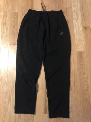 Pantalones deportivos New Balance grandes negros con cordón sm. agujero en rodilla rt Foto 1 de 4