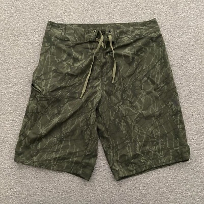 Bañador Under Armour para hombre talla mediana verde sin forro bolsillo Foto 1 de 4