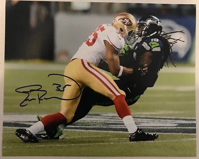FOTO 8x10 firmada por Eric Reid 49ers V. Seahawks ~ certificado de autenticidad y foto de prueba Foto 1 de 2