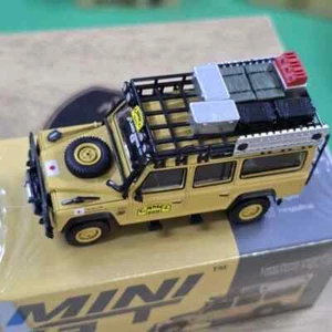 MINI GT LAND ROVER DEFENDER 110 1989 CAMEL TROPHY AMAZON TEAM JAPAN - Picture 1 of 4