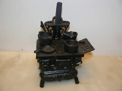 Gaziniere cuisiniere ancienne en fonte, jouet - Photo 1/4