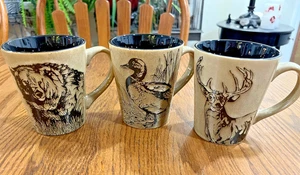 SET Of 3 ~ MOSSY OAK Wildlife BLACK Tan Stoneware MUGS ~ Moose, Duck, Bear EXC - Picture 1 of 9