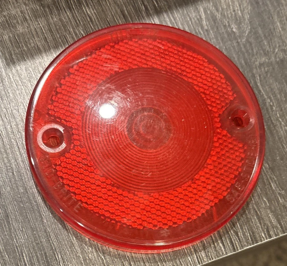 Cubierta de lente de luz de lámpara trasera de parada NORS Glo-Brite TMC-737 1933-66 Ford (712) Foto 1 de 4