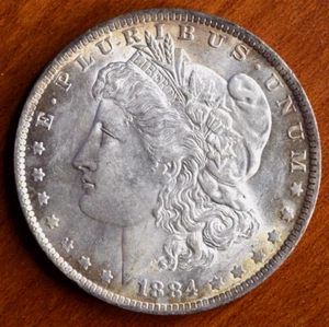1884-O Morgan Silver Dollar AU - Picture 1 of 2