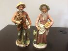 Vintage HOMCO #8884 Figurines Man With Logs Woman With Potatoes and Hoe Lot Of 2