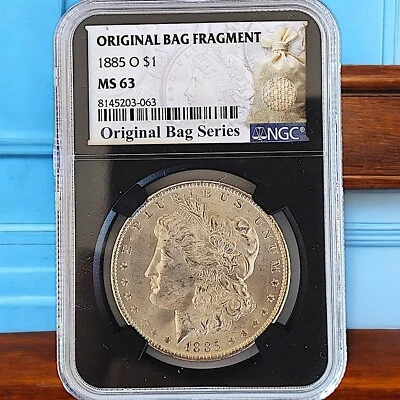 Dólar de plata O Morgan 1885 - NGC MS 63 - Serie Fragmento Bolsa Original Foto 1 de 3