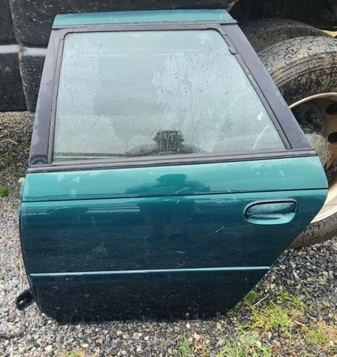 Зеленая задняя водительская дверь 1995 Ford Taurus SHO - Изображение 1 из 4