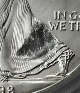 1998 NGC MS68 Large Struck Thru & Retained Plastic Silver Dollar SAE Mint Error - Picture 1 of 6