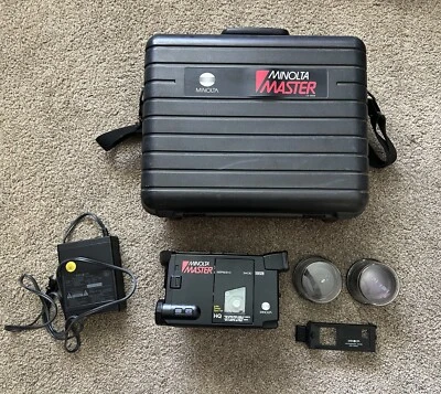 1988 MINOLTA MASTER SERIES- C MODEL 3400 VHS(C), Battery Charger, Lenses, Case - Image 1 of 4