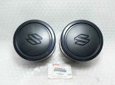 TAPA CENTRAL RUEDA SUZUKI VITARA ESCUDO SIDEKICK SAMURAI JIMNY SIERRA GENUINA 2 un. Foto 1 de 3