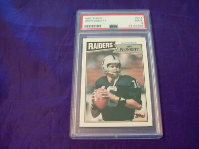 1987 TOPPS FOOTBALL #214 JIM PLUNKETT PSA 9 - Imagem 1 de 2