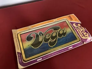 NOS CHEVROLET VEGA FOXY FACES CHROMA GRAPHICS 1976 LICENCE PLATE PLASTIC - Picture 1 of 3