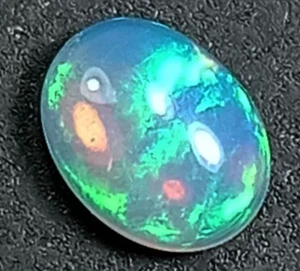1.04Cts_Eye-catching Multi-Color Oval 100% Natural White Opal Gemstone M246 - Picture 1 of 4