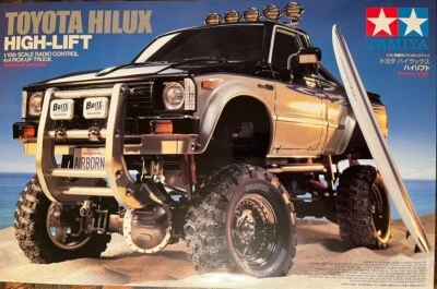 Tamiya 1/10 No.397 TOYOTA HILUX HI-LIFT EP Crawler RC Car Kit 58397 Nuovo - Immagine 1 di 4