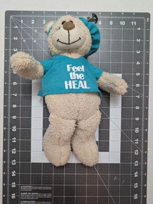 Primera y Principal Exfoliante Enfermera Doctor Oso Rubio "Feel the Heal" Camisa 12 pulgadas Juguete Foto 1 de 4