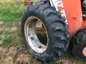 IH INTERNATIONAL 300 UTILITY REAR TRACTOR TIRE GOODYEAR 13.6x28 ON 6 LOOP RIM - Picture 1 of 6