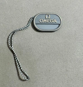 Omega Uhr original grau Referenz Kunststoff Hang-Tag - Bild 1 von 1