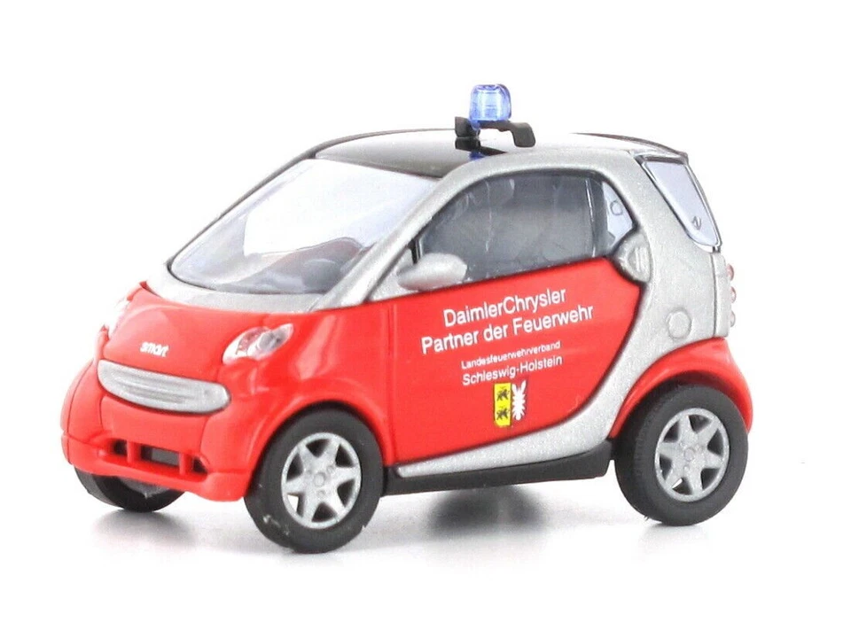 Busch 489315 Smart City Coupe Vigile Del Fuoco Schleswig Holstein HO 1:87 NUOVO - Immagine 1 di 1