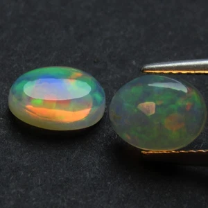 2.50Cts Stunning Multi Color Play Ethiopia White Opal 9x7mm Oval Pair Gemstones - Picture 1 of 6