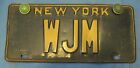 New York license plate older vanity with green reflectors