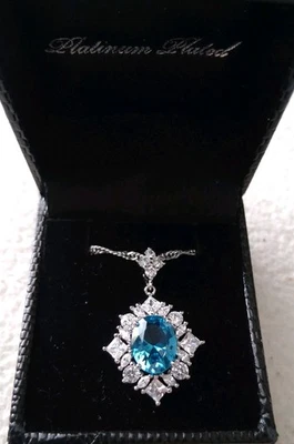 NIB Gold Coast Platinum Plated Blue Topaz Pendant Necklace Surrounded by CZ's  - Image 1 of 4