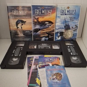 Free Willy 1, 2 and 3 VHS Clamshell VHS Tapes With Whale Pendant Compass - Picture 1 of 12