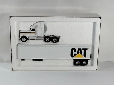 International Cab 带拖车 - 1989 年 ERTL 卡特彼勒促销版 7712 — 第 1/4 张图片