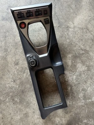 2017-2024 NISSAN R35 GTR GT-R CENTER CONSOLE SHIFTER BEZEL WITH TRACTION BUTTONS - Image 1 of 4