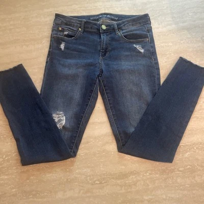 Pantalones de mezclilla para mujer talla 27 tiro medio desgastados, dobladillo crudo elástico Foto 1 de 4