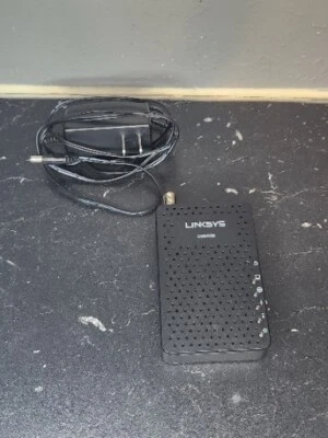 Linksys cable modem CM3008, with power adapter, Excellent Working shape. - Image 1 of 2