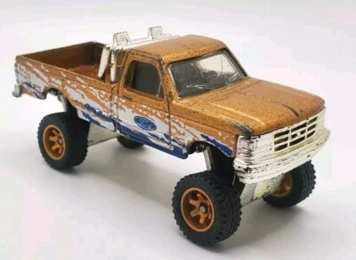 Matchbox WHEEL SWAP Ford '93 F-150 4x4 14mm Gold 6 Spokes Off Road Rubber Tires  - Image 1 of 4