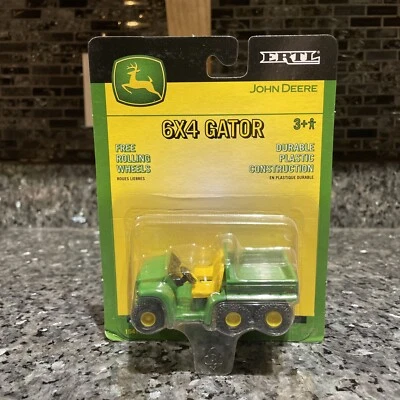 Vehículo de plástico John Deere Gator 2003 ERTL 15411 escala 1:64 nuevo en paquete Foto 1 de 4