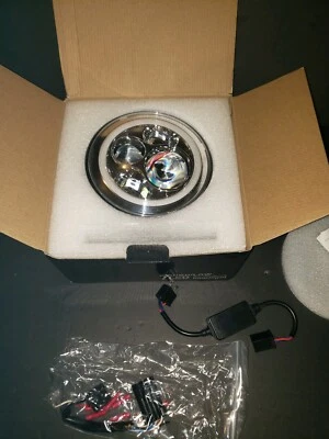 Faro LED redondo DOT 7 pulgadas/con ojos de ángulo halo apto para Jeep Wrangler JK LJ TJ Foto 1 de 4