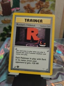 Neo Revelation, #63/64 Rocket's Hideout, 1st Edition Pokémon Card