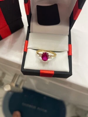 10k solid yellow gold ring with red ruby lab creatrd and 2ehiteh mm mhmhmhnhnhn - Image 1 of 3