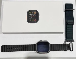 Apple Watch Ultra 2 49mm GPS + Cell Titanium Case w/ Black Ocean Band MX4P3LW/A - Photo 1 sur 6