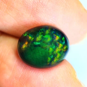 4.2Ct Very good Oval cut 13 X 10 mm Multi Color Play Black Fire Opal - Bild 1 von 5
