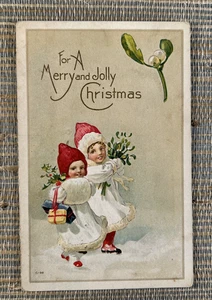 For A Merry & Jolly Christmas Girls Mistletoe Holly Embossed Postcard Henderson - Picture 1 of 2