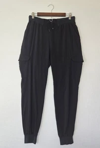 Lote de dos pantalones exfoliantes Jaanuu para mujer joggers y tobillos con cremallera 6 bolsillos talla mediana negra - Imagen 1 de 19