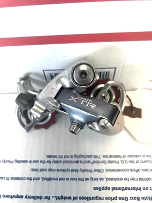 Desviador trasero vintage Shimano XTR RD-M910 con ruedas jockey rojas jaula mediana Foto 1 de 3