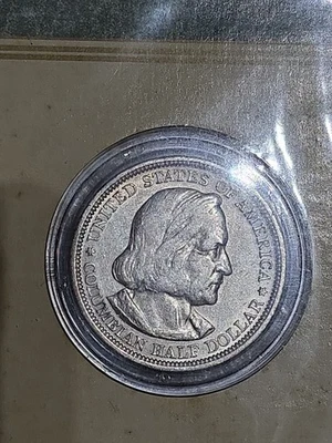 U.S. mint 1893 Colombian Exposition Half Dollar 90% Silver BU. Original book. - Image 1 of 4