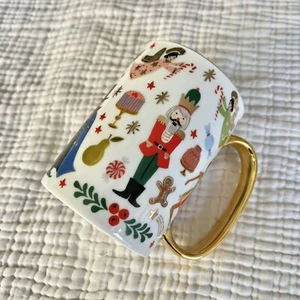 Taza de Navidad Cascanueces Anthropologie Rifle Paper Co porcelana mango dorado - Imagen 1 de 6