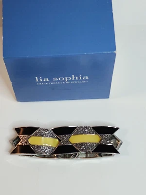 Pulsera Lia Sophia elástica negra, plateada y genuina madreperla. Foto 1 de 4