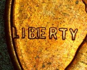 1957 RED Lincoln Penny - *MAJOR IBE Obverse ERROR* - Picture 1 of 3