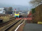 PHOTO  HEADING NORTH FROM CRAVEN ARMS A MANCHESTER BOUND TRAIN HAS RUN NON-STOP