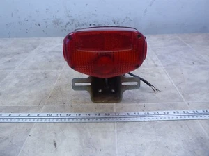 1979 Suzuki GS1000L S354-1) rear brake tail light with mount bracket - Picture 1 of 12